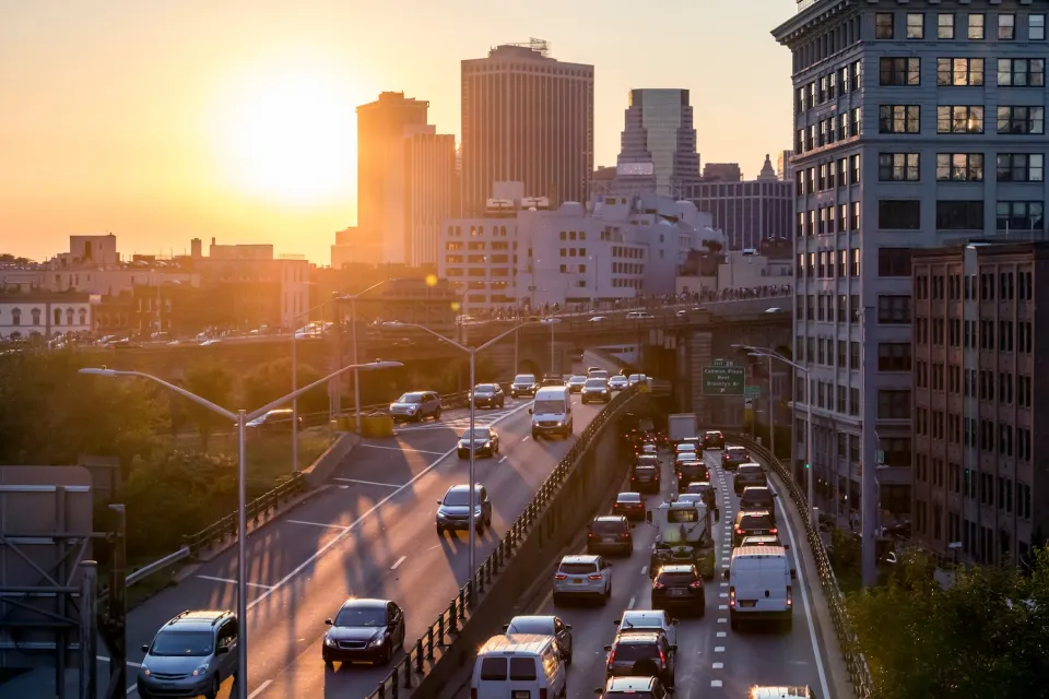 New York City traffic on elevated highway at sunset.